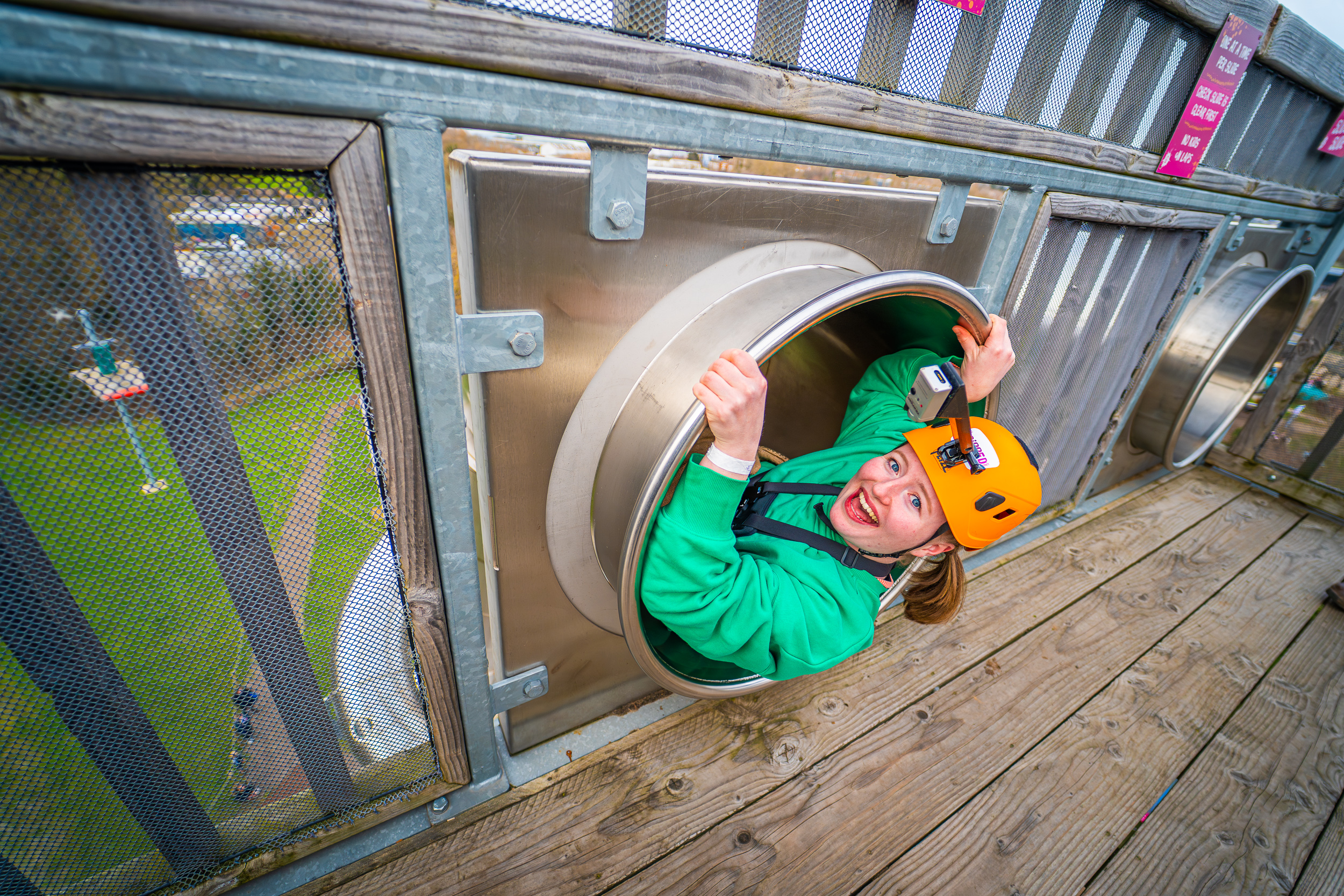 Female influencer about to take on high-speed slides at Gripped West London, perfect for social media and influencer content